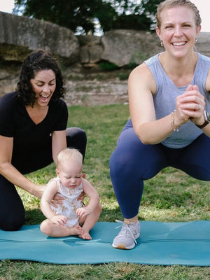 Our founder, Lauren, engaging in pelvic floor physical therapy with her baby and a Lady Bird PT specialist—real-life care, support, and movement in action.