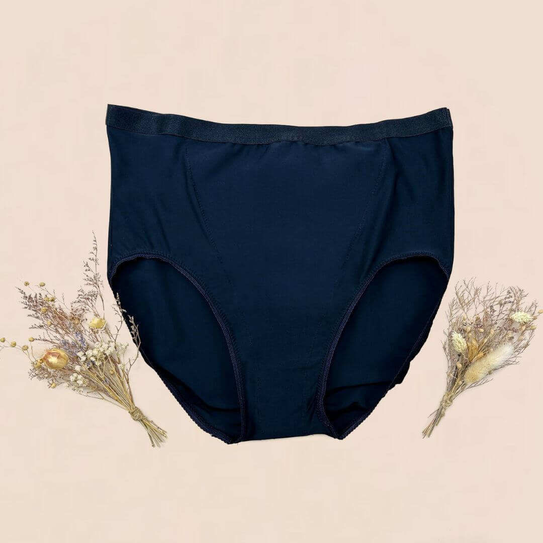 Underwear designed to help alleviate symptoms of pelvic organ prolapse and other pelvic floor conditions. Image shows flat lay of black high waisted underwear with targeted pelvic floor support.